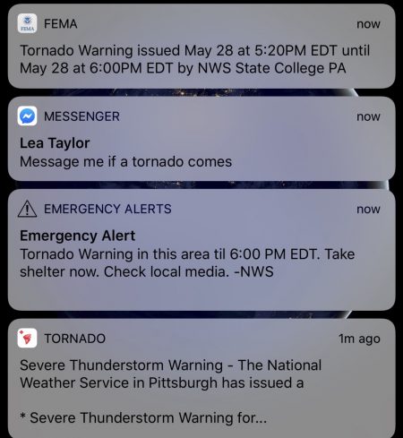 Screenshot of several push notifications from different apps, as well as a WEA showing a tornado warning for the author’s location on May 28, 2019.